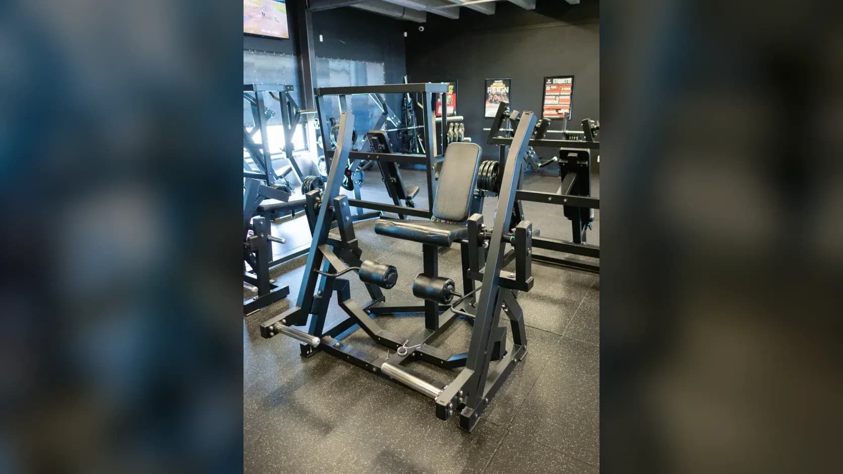 Plate-loaded leg extension machine at Inception Gym Christchurch for quad isolation