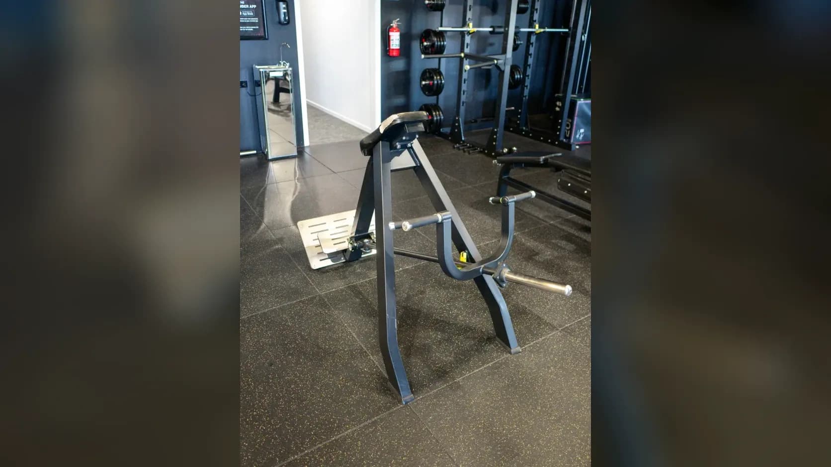 Member training on a plate-loaded row machine at Inception Gym Christchurch